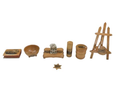 MAUCHLINE WARE; seven pieces comprising a painted easel, 'Village Green, Heacham', height 21cm, an inkwell on Mauchline base,