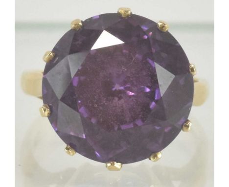 A 9ct yellow gold amethyst set dress ring, the large central amethyst approx 7ct, size O/P, approx 7.1g.