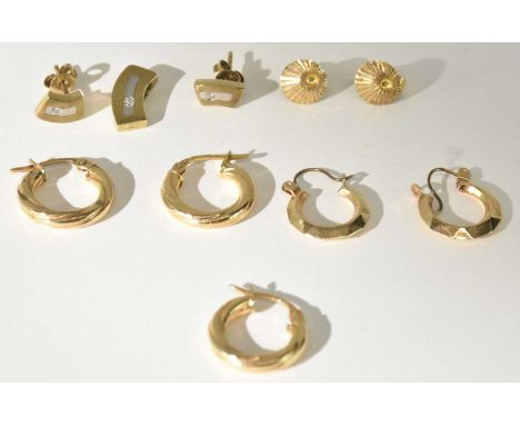 Thee 9ct yellow gold hoop twist earrings, a pair of yellow metal hoop earrings, a pair of 9ct pearl set earrings (one lacking