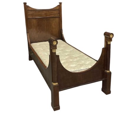 A 19th century French Empire mahogany gilt metal mounted single bed, length approx 218cm, width approx 93cm, with single matt