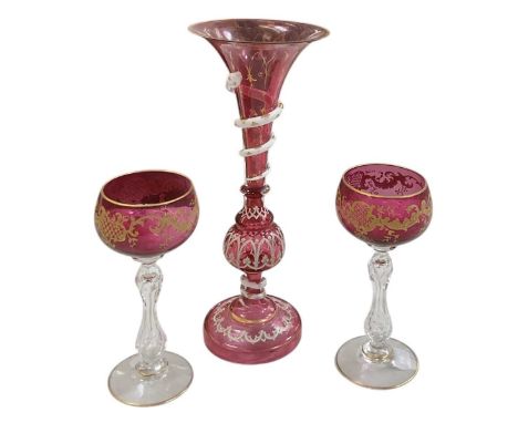 A late 19th century cranberry glass snake vase, with gilt and white painted decoration and a snake scrolling the stem, height