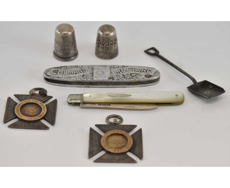 A George V hallmarked silver mother of pearl handled folding fruit knife, length approx 7.5cm, a white metal royal commemorat