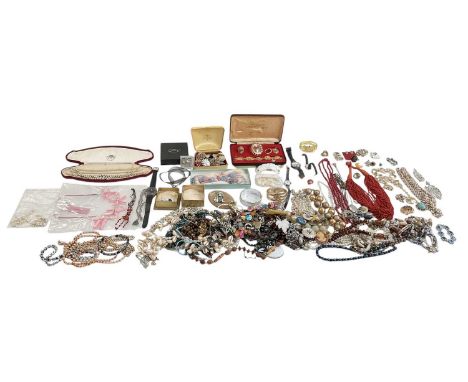 A large quantity of assorted costume jewellery including bangles, watches, beads, necklaces, bracelets, rings, earrings, pear