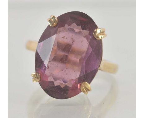 A 9ct yellow gold amethyst set ring, the large central amethyst approx 5ct, size M, approx 5.4g.