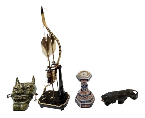 A modern Japanese black lacquered child's Samurai bow and arrow set on stand, height 59cm, a late 19th/early 20th century Ima