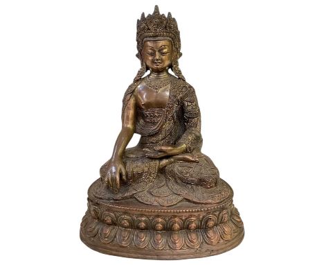 A late 19th/early 20th century Sino-Tibetan gilt bronze figure of a seated Buddha, marked with lotus leaf design to the under