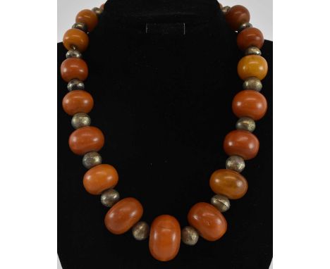 An African white metal and amber effect bead single strand necklace, length approx 50cm.