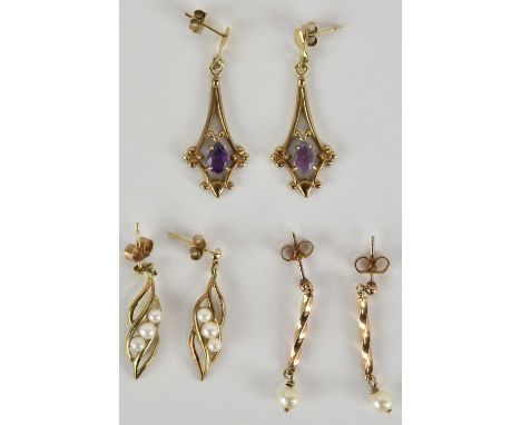 Three pairs of 9ct gold earrings comprising two Edwardian style with claw set pear shaped amethyst stones, a pair of twist co
