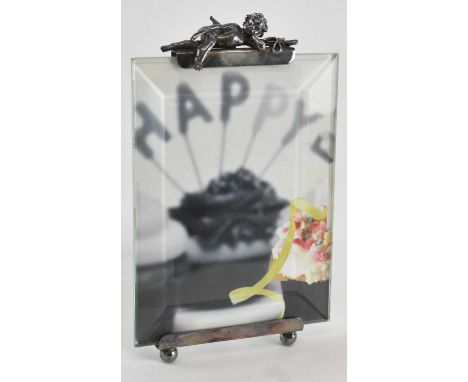VICTORIA SILVERWARE LTD; an Elizabeth II hallmarked silver mounted easel back photograph frame, surmounted with decoration of