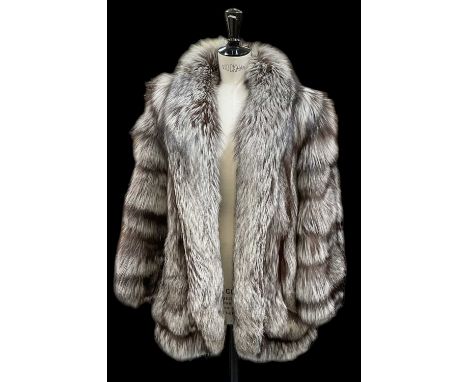 A vintage short silver fox fur coat.