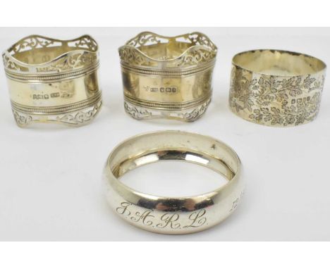 Four hallmarked silver napkin rings, comprising two matching and two miscellaneous, combined approx 2.6ozt (4).