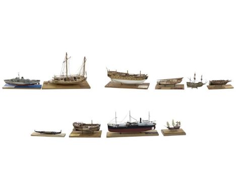 A modern kit built 1:144 scale boat, 'WW2 Flower Class Corvette HMCS Snowberry', mounted on blue painted modern wooden plinth