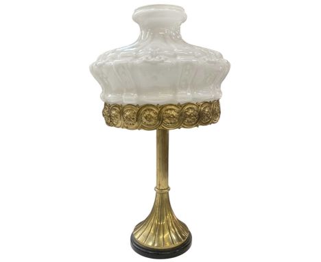 A late 19th/early 20th century brass table lamp, with opaque white glass shade, height 53cm.
