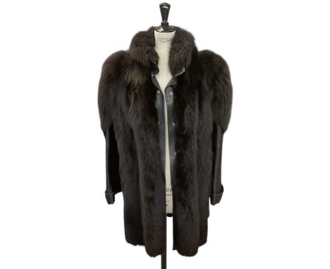 YOUR SIXTH SENSE; a vintage black leather and black mink fur coat.