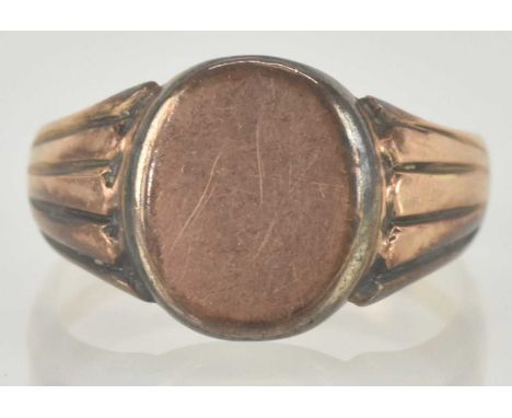 A 9ct rose gold signet ring, with blank oval table, size T, approx 4.7g.