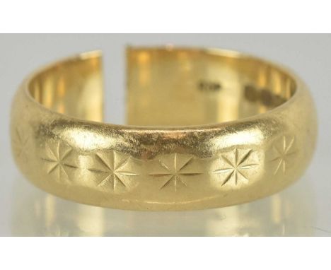 An 18ct gold band ring with cut shank, size N (when pushed together), approx 5.73g.