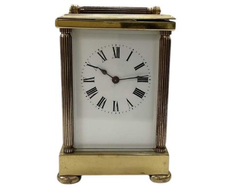 A modern French brass cased carriage clock, the white painted dial set with Roman numerals and subsidiary seconds, height 14c