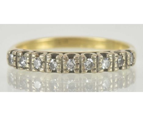 An 18ct gold half hoop diamond set ring, the top set with nine small diamonds, size Q, approx 3.2g.