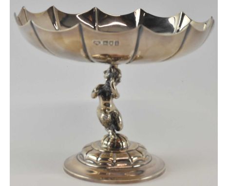 GOLDSMITHS &amp; SILVERSMITHS CO LTD; an Edward VII hallmarked silver pedestal bonbon dish with central stem modelled as youn