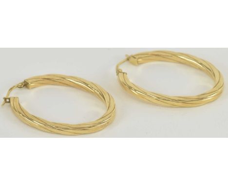 A pair of 9ct yellow gold oval hoop earrings, both 3.5 x 2.5cm, combined approx 2.4g.