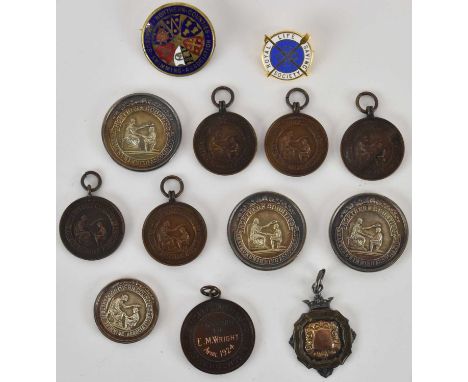 A group of various early 20th century swimming medals, including four silver examples, combined approx 2.7ozt, and various br