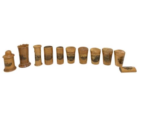 MAUCHLINE WARE; a quantity of eleven items comprising five beakers with lids, 'Stirling Castle, from Back Walk', 'Ripon Cathe