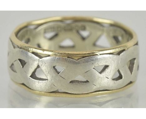A 9ct gold ring, the open white gold Celtic centre with yellow gold sides, size O, approx 4.1g.