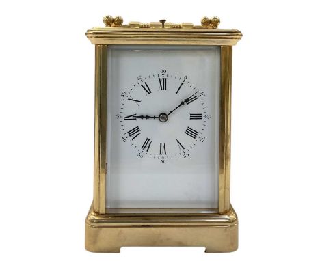 An early 20th century French brass repeating oversized carriage clock, height 13cm, width 9.5cm, depth 8.5cm.