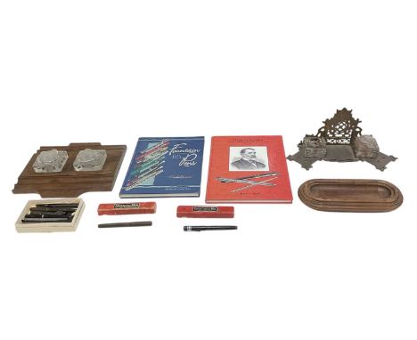 An early 20th century oak tabletop inkstand, with two lidded glass wells, 26 x 28cm, a further early 20th century brass table