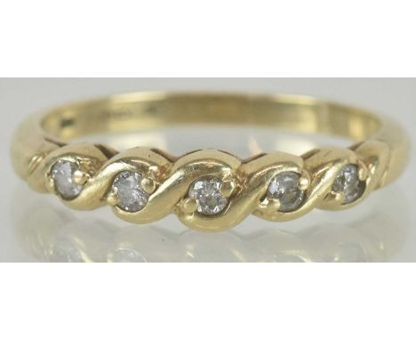 A 9ct gold ring, set with five small diamonds, size R, approx 2.1g.