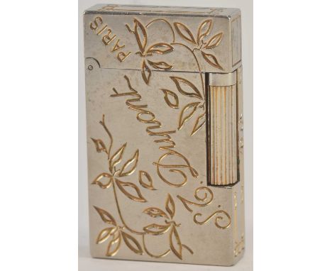 IN THE STYLE OF ST DUPONT, PARIS; a modern white metal cigarette lighter, inscribed 'S.T. Dupont Paris', and inscribed with f