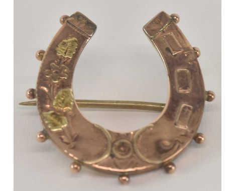 A 9ct yellow gold horseshoe brooch, 2 x 2cm, approx 1.5g.