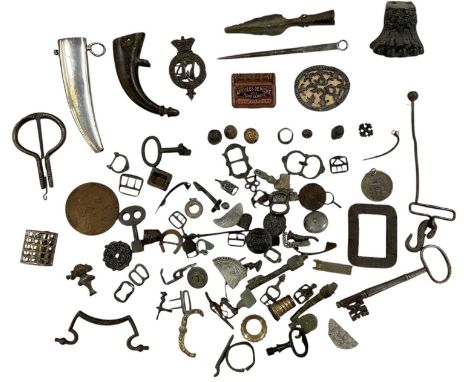 A group of assorted curios and metal detecting finds, including medallions, keys, metal mounts, knife scabbards, buckles, coi