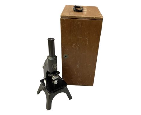 C BAKER OF LONDON; a cased mid 20th century microscope, inscribed '11982', the case fitted with additional lenses and slides,