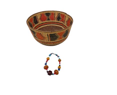 A large modern Sudanese wicker bowl, diameter 33cm, height 20cm, and a semi-precious stone, amber bead and glass bead necklac