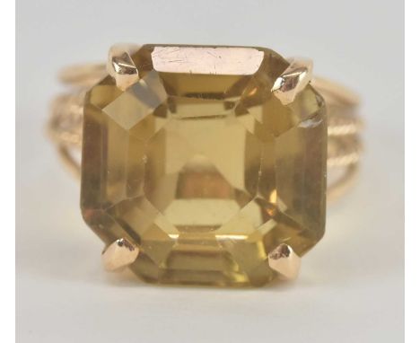 A yellow metal dress ring set with large square cut citrine, size V/W, approx weight 10g.