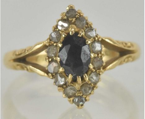An Art Deco 18ct yellow gold diamond and sapphire set ring, the central cut claw set sapphire within an eye shaped border of 