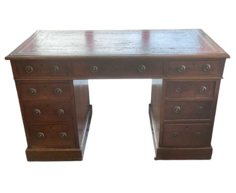 A late 19th/early 20th century mahogany pedestal desk, with red leather gilt tooled inset top, width 122cm, depth 60cm, heigh