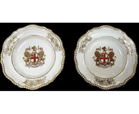 SPODE; a pair of late 18th/early 19th century English porcelain armorial plates 'The London', both bearing crests to the fron