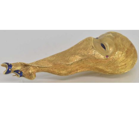 An 18ct yellow gold ruby and blue enamelled brooch modelled as lady with Indian style head wear and jewellery, length approx 