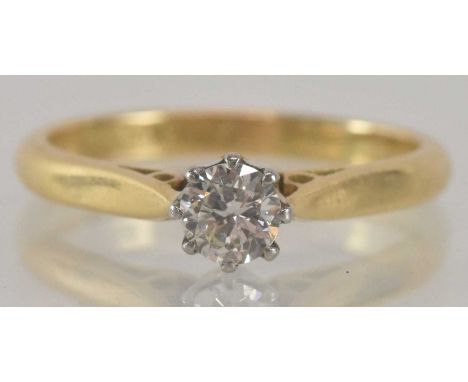 An 18ct yellow gold and platinum diamond solitaire ring, the central stone approx 0.4ct, size M, approx 2.6g.