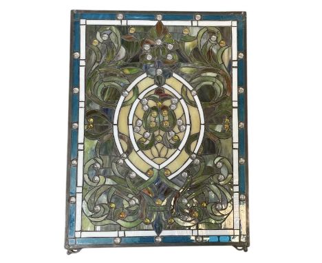 IN THE STYLE OF TIFFANY &amp; CO; an early 20th century rectangular stained glass panel, 63.5 x 48.5cm.