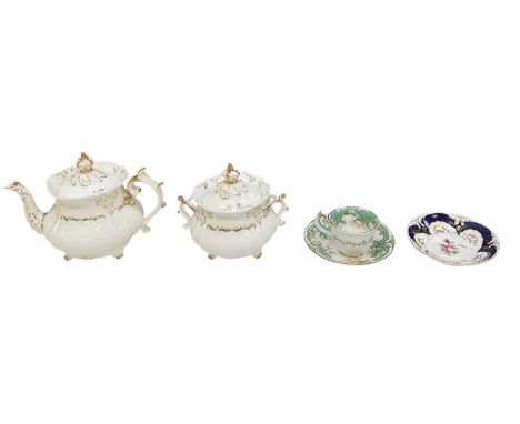 ROCKINGHAM; a mid 19th century white ground gilt decorated teapot and matching twin handled lidded sugar bowl, both surmounte