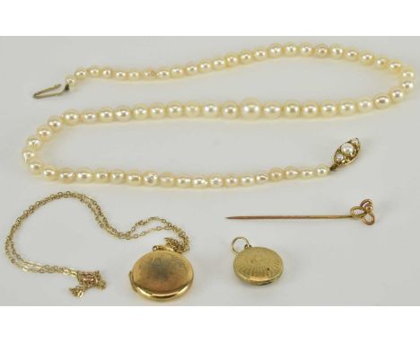A small 9ct gold circular double locket with floral decoration, diameter 1.8cm, on a 9ct gold dainty chain with ring clasp, l