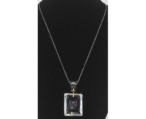 A late 19th/early 20th century faceted rock crystal necklace pendant of cushion shape, set with amethyst and silver fly, 6.8 