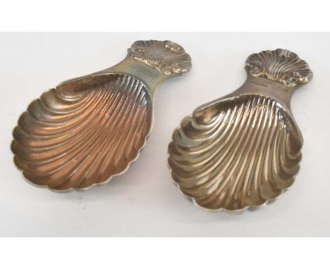 RAY HALL; a modern hallmarked silver caddy spoon, modelled as a shell, Birmingham 1959, length 8cm, and a similar matching mo