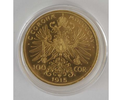 A Franz Joseph I Austrian 100 coronas gold coin, 1915, with imperial eagle and coat of arms to the reverse, 900/1000 fineness