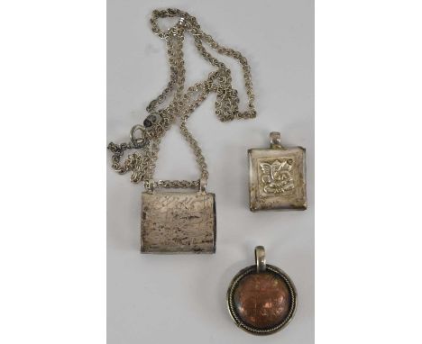 A white metal Nepalese miniature Torah holder on 925 silver chain, chain approx length 40cm, a white metal pendant engraved t