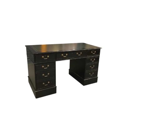An early 20th century ebonised pedestal desk, with green leather gilt tooled inset top, top 137 x 69cm.