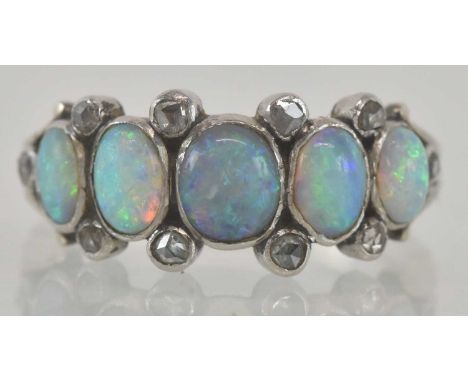 An 18ct white gold and platinum diamond and opal set five stone ring, size P, approx 4.1g.